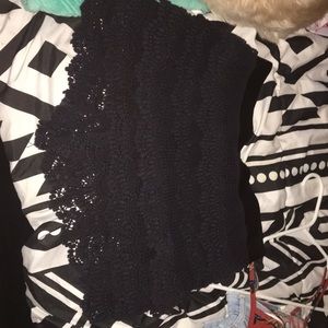 All black crochet shorts.